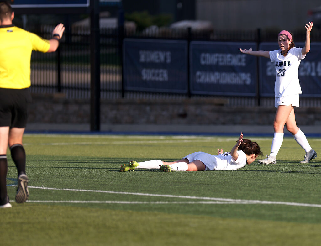 Columbia College players challenge a call